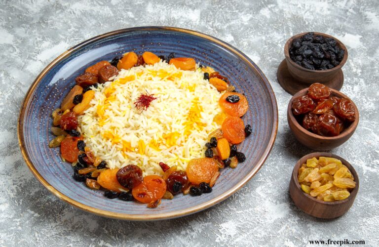 front view yummy shakh plov cooked rice dish with raisins inside plate white floor dinner cooking rice dish meal