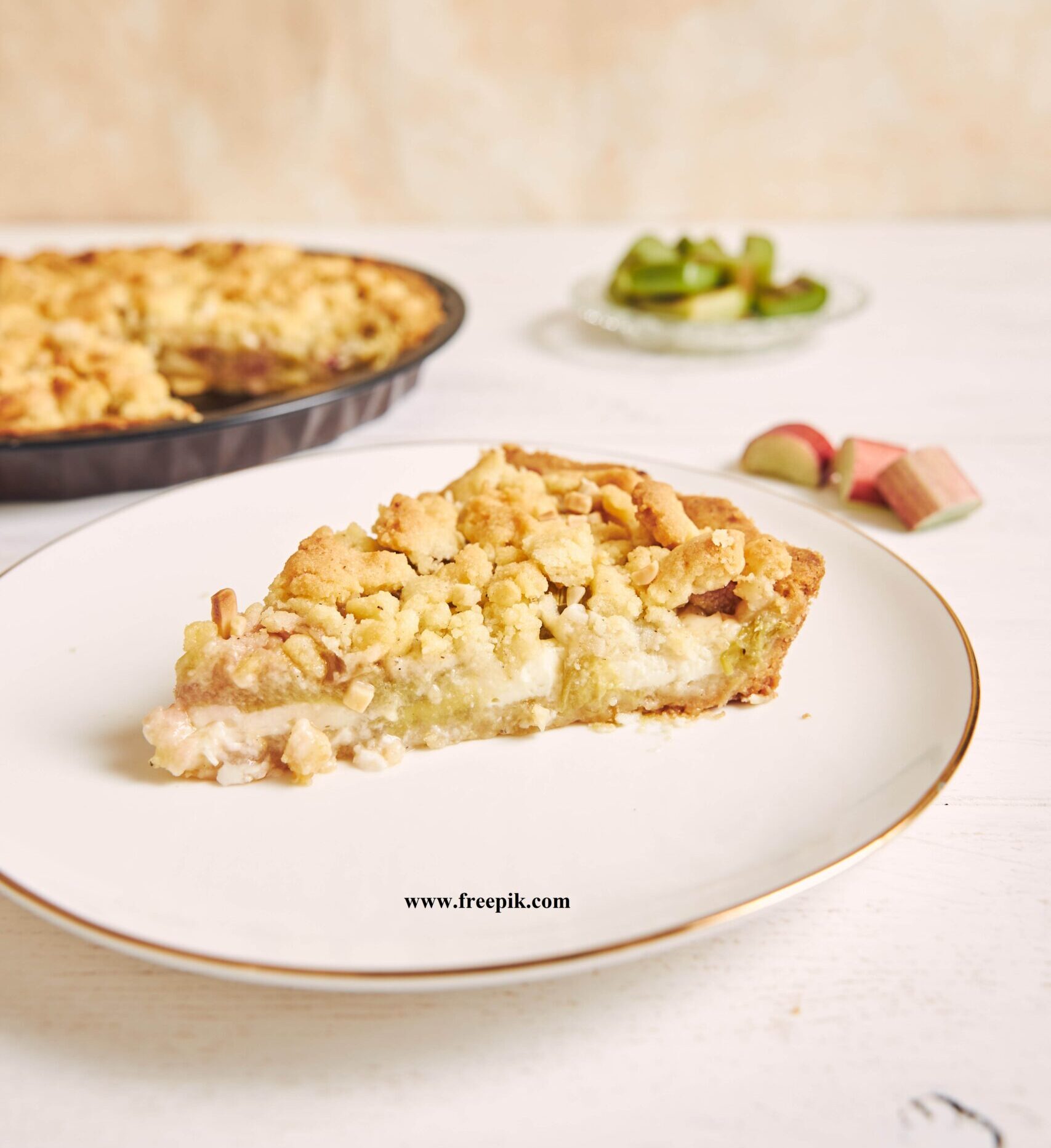 🥧Kəsmikli piroq vertical shot of a slice of crispy rhabarbar cake tart on a white plate with some fruits